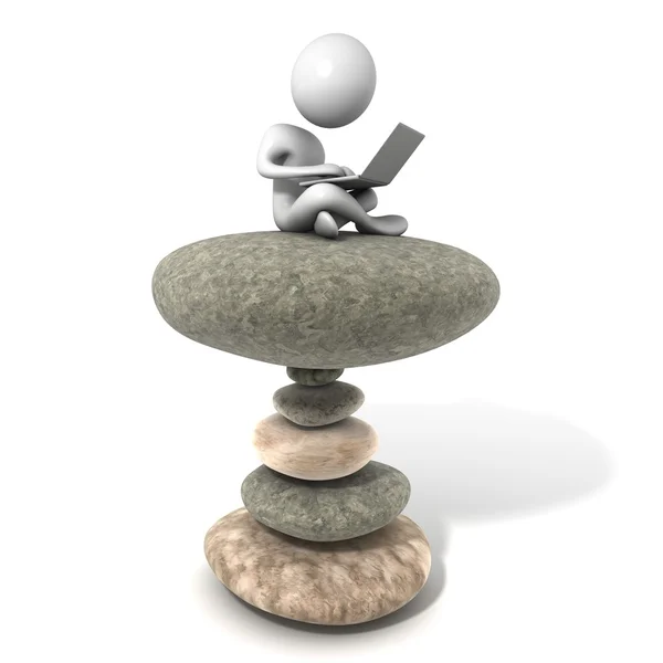 Young man sitting on stack of stones with the Laptop. — Stock Photo, Image