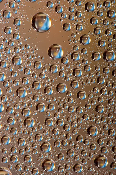 Gotas de agua oro con azul — Foto de Stock