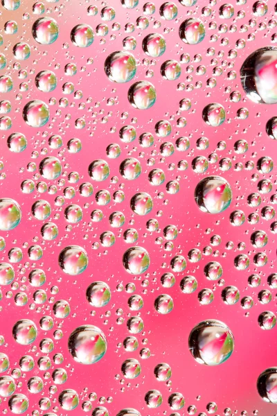 Рожева вода краплі — стокове фото