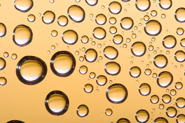 Abstract gold water drops — Stock Photo, Image