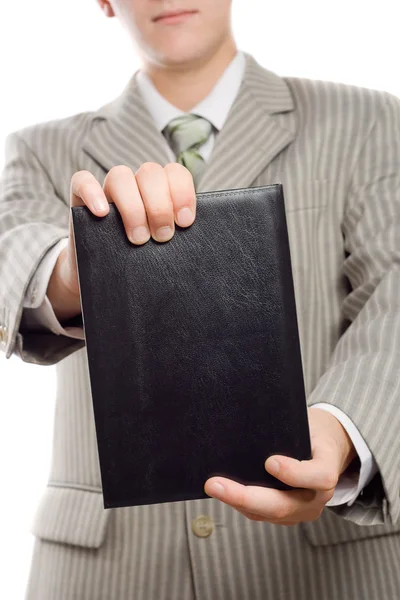 Бизнесмен держит книгу — стоковое фото