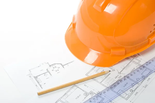 Orange helmet, pencil, ruler and blueprint — Stock Photo, Image