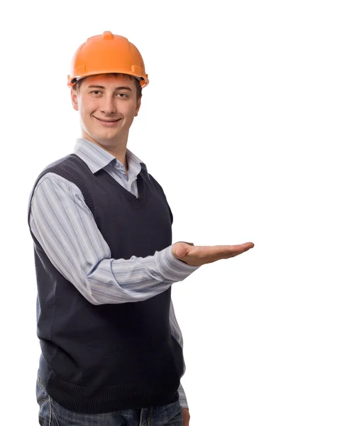 Hombre en casco naranja mostrando la palma vacía —  Fotos de Stock