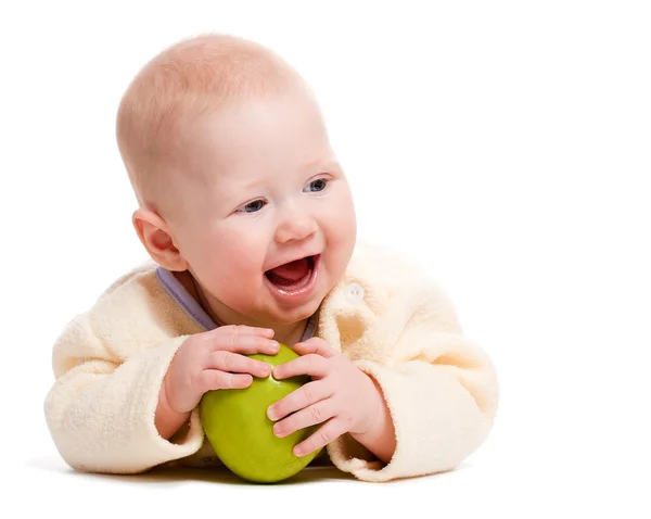 Laying little boy with apple — Stock Photo, Image