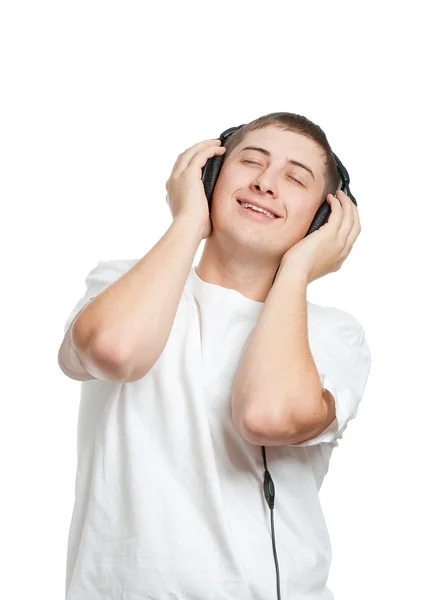 Jonge man de muziek luisteren — Stockfoto