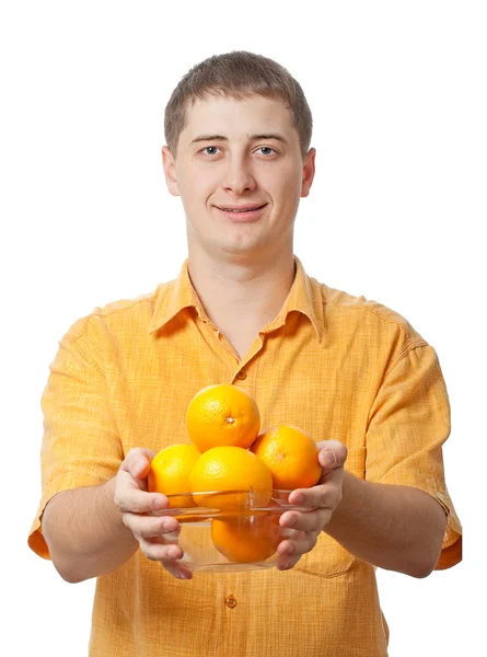 Uomo con frutti arancioni in mano — Foto Stock