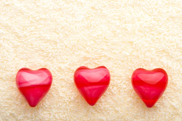 Three oil hearts on towel — Stock Photo, Image