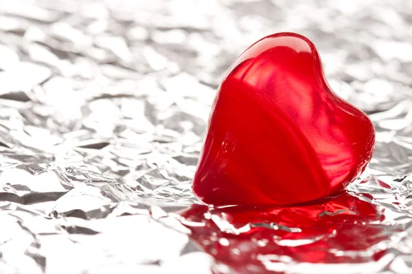 stock image Red heart on foil