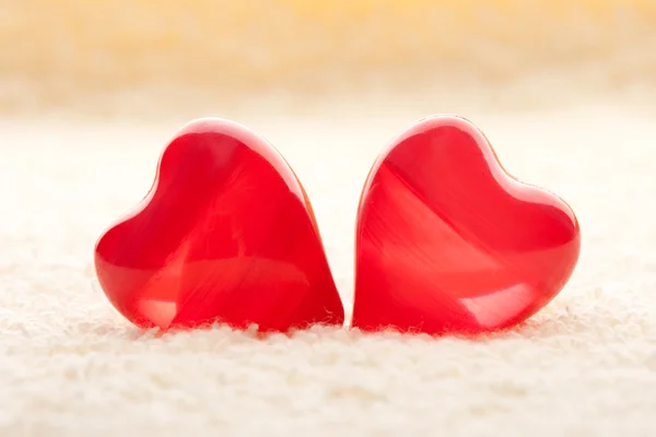 Macro two red hearts on towel — Stock Photo, Image
