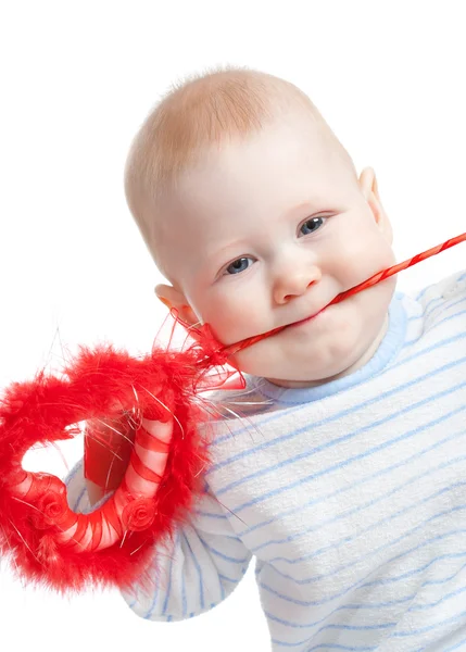 Baby boy with furry heart in mouth — Stock Photo, Image