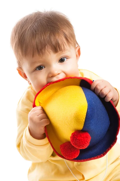 Bebê menino roer chapéu de palhaço — Fotografia de Stock