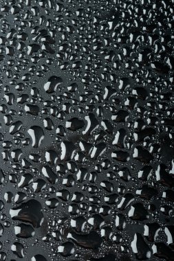 Water drops on black surface clipart