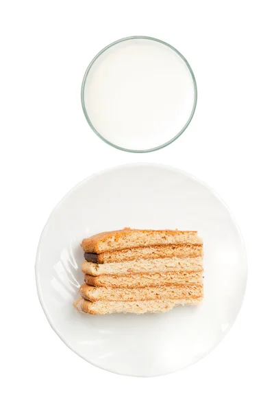 Milch und Kuchen von oben — Stockfoto