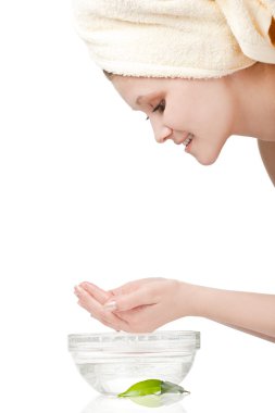 Young woman washing face clipart