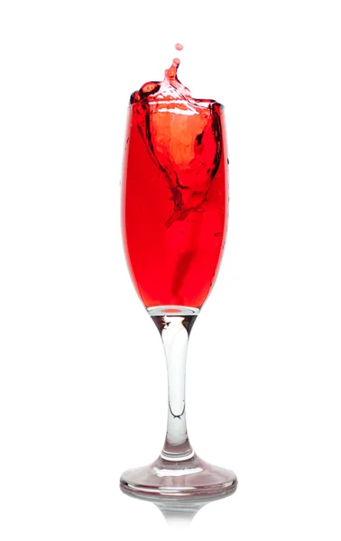 Wine glass with splashing red wine — Stock Photo, Image
