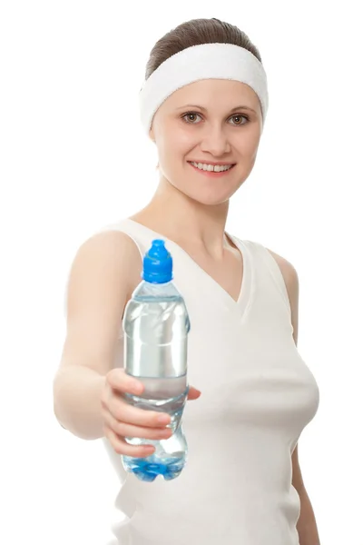Woman giving bottle of water — Stock Photo, Image