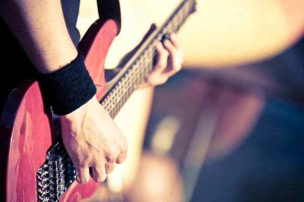 Red guitar playing — Stock Photo, Image