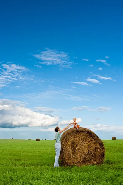 Woman and boy in the field — Stock Photo, Image