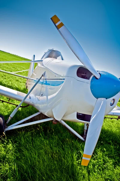 Closep airplane on the field — Stock Photo, Image