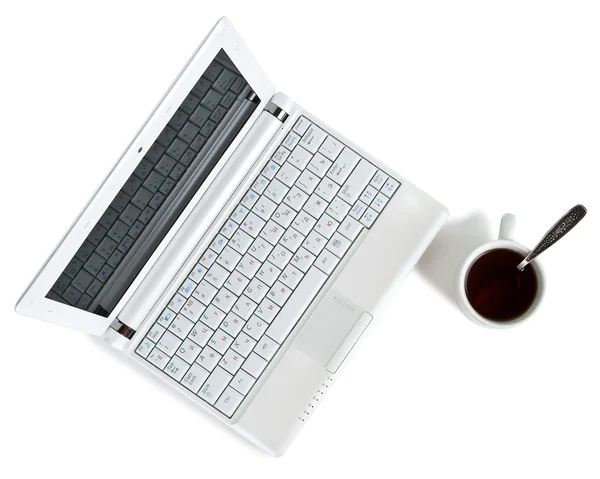 White netbook with coffee top view — Stock Photo, Image