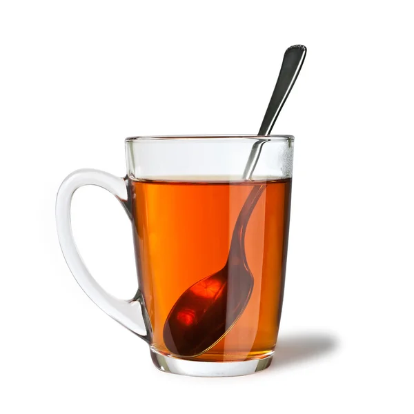 Ізольований чай з ложкою — стокове фото