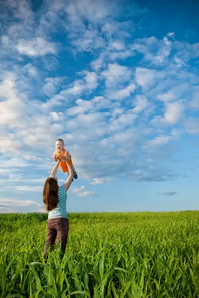 Mother and son in the field — Stock Photo, Image