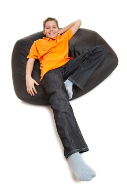 Teenager on pouffe clipart