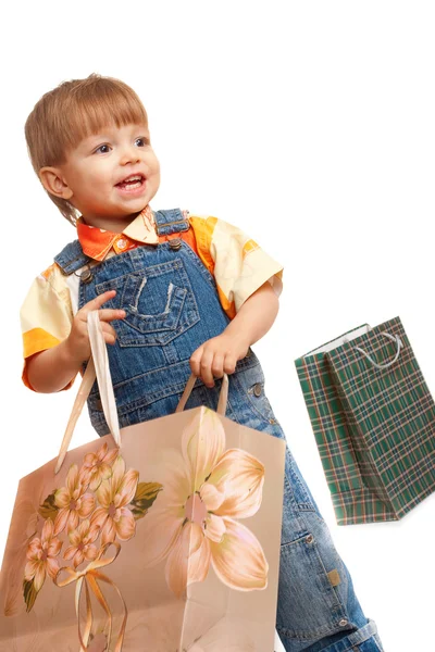 Niño pequeño con bolsas — Foto de Stock