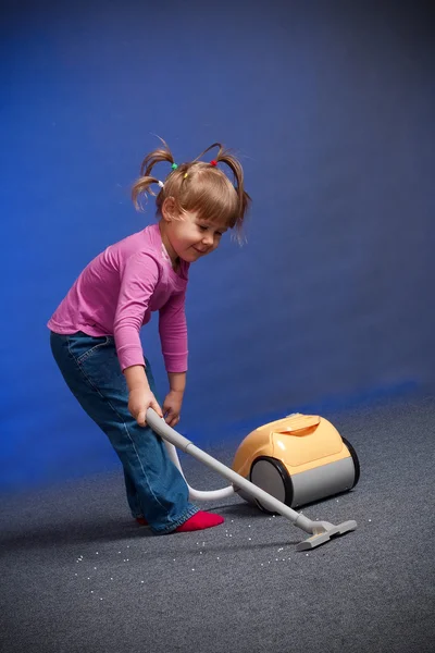 stock image Girl cleaning carpet