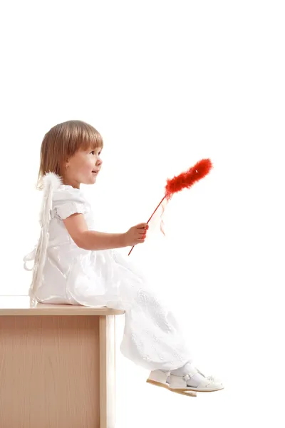 Little girl with red magic wand — Stock Photo, Image