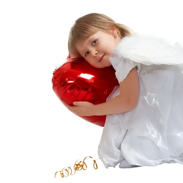 Cute little girl with red heart balloon — Stock Photo, Image