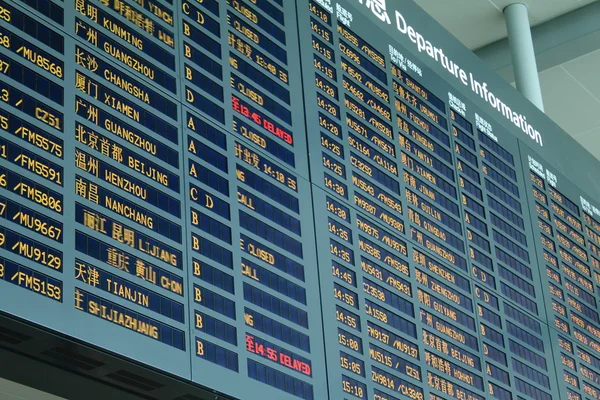 Arrival board at airport — Stock Photo, Image