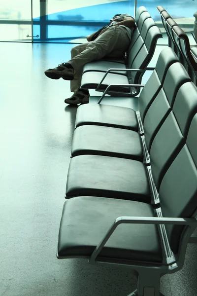 Sleeping traveller on the bench — Stock Photo, Image