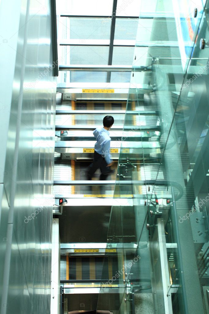 Businessman walking on the elevator
