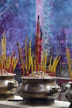 Incense offerings at the temple clipart