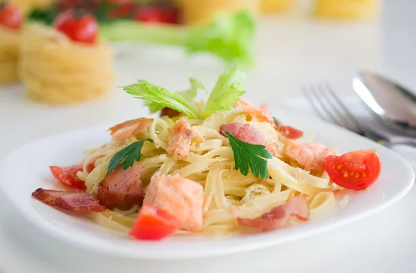 stock image Pasta with bacon and salmon