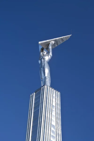 stock image Monument - the person holding the wings