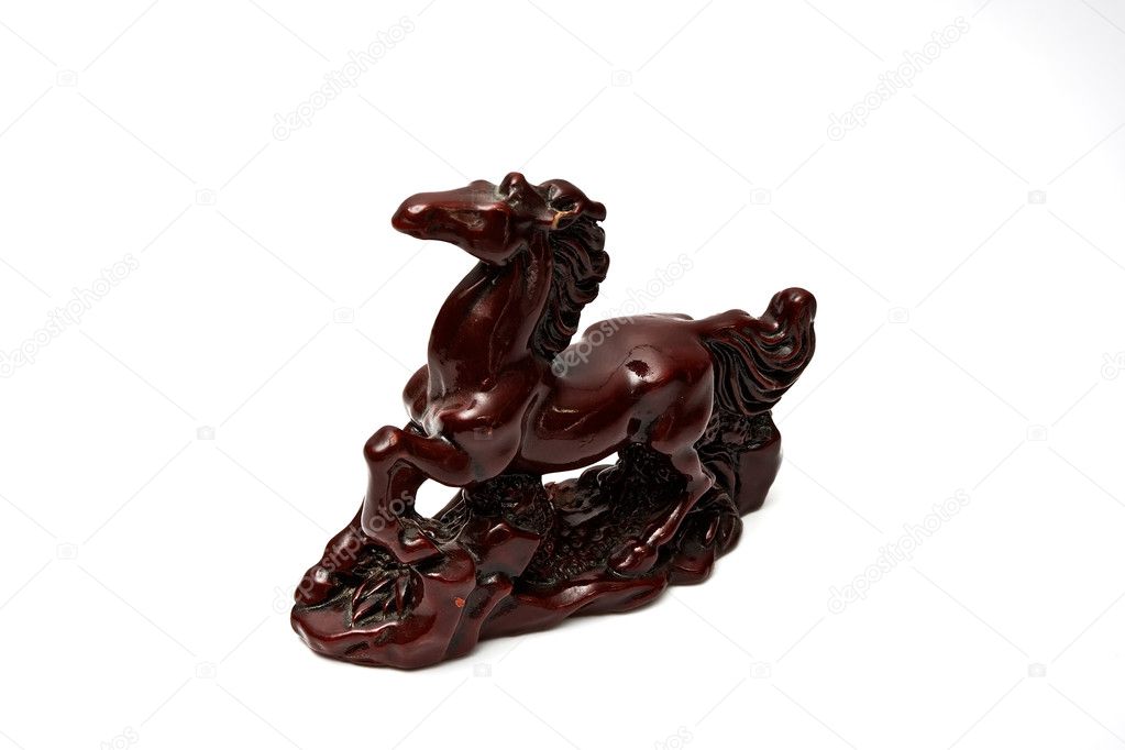 Ceramic souvenir figure of a horse. Isolated on a white backgrou