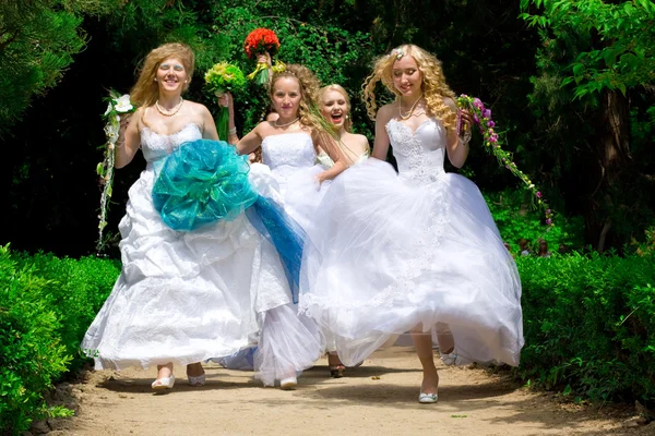Happy dancing brides — Stock Photo, Image