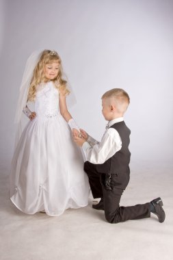 Boy and Young Girl exchange of rings clipart