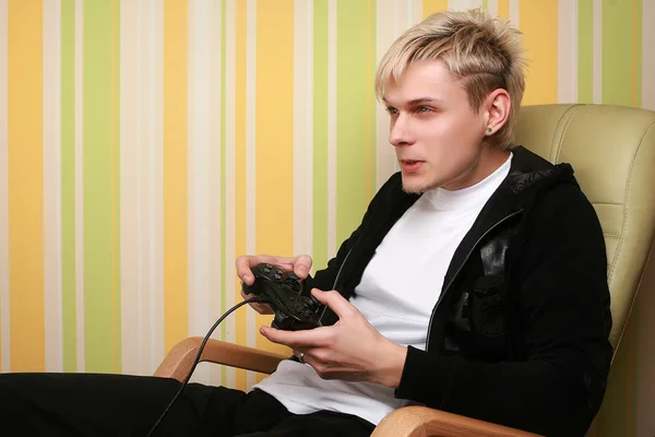 Stock image Excited young adult playing videogame