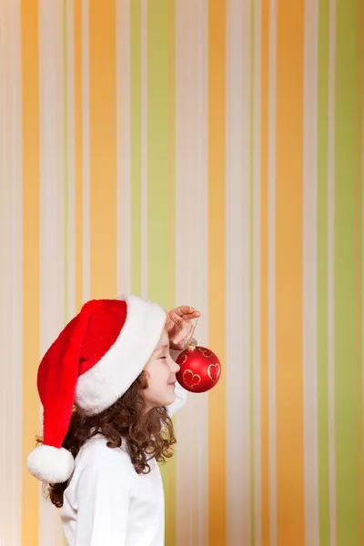 Little girl wearing santa hat — Stock Photo, Image