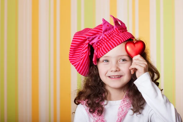 Girl with red heart — Stock Photo, Image