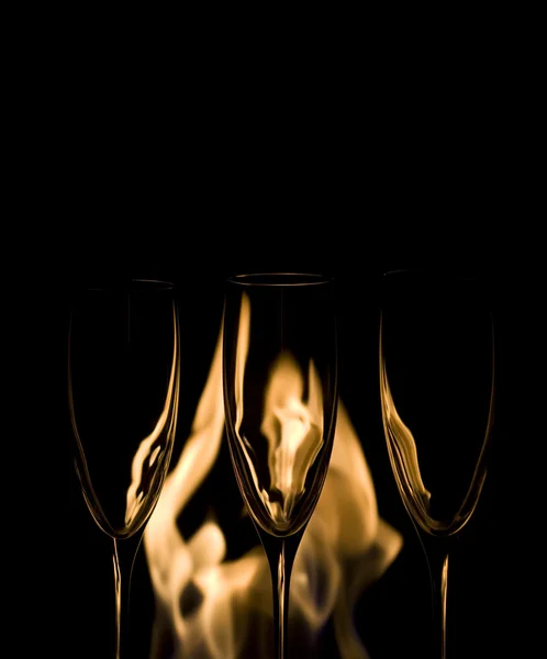 Three Crystal glasses and fire — Stock Photo, Image