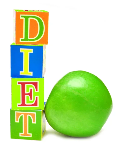 Grüner Apfel und Würfel mit Buchstaben - Diät — Stockfoto