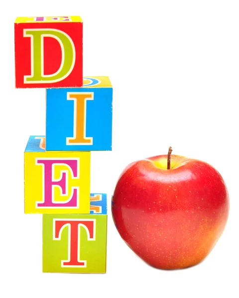 Czerwone jabłko i kostki z literkami - dieta — Zdjęcie stockowe