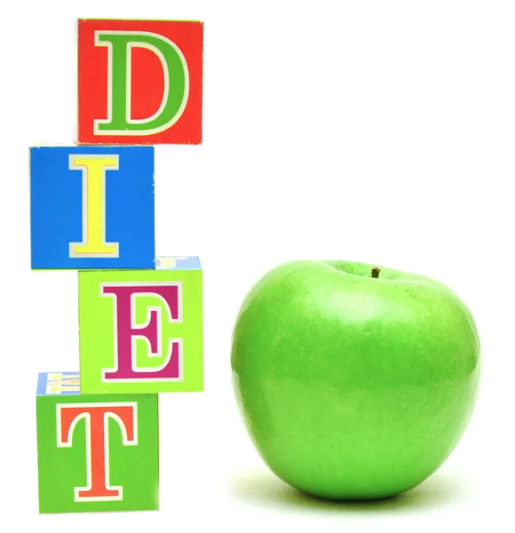 Zielone jabłko i kostki z literkami - dieta — Zdjęcie stockowe