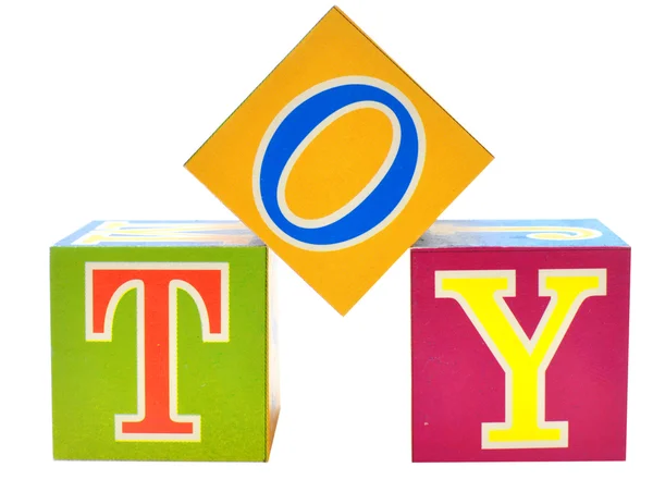 Palabra de juguete deletreado en bloques de juguetes —  Fotos de Stock