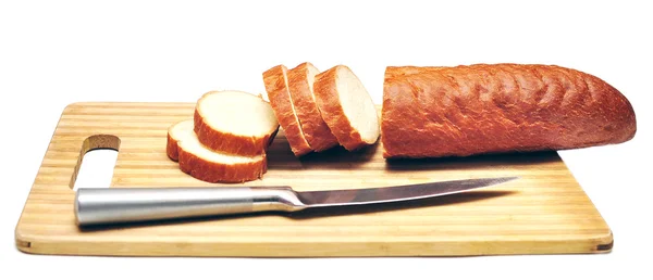 Baguette sliced with a knife — Stok fotoğraf