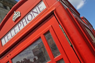 Red telephone booth in London clipart